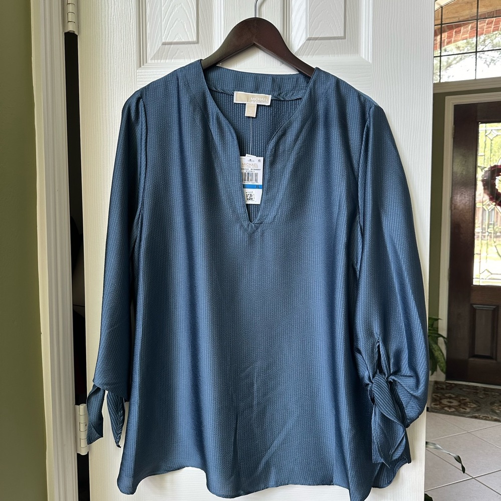 Michael Kors blue top.
